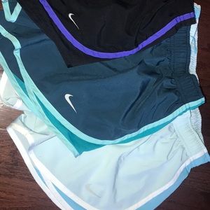 3 pairs of nike running shorts